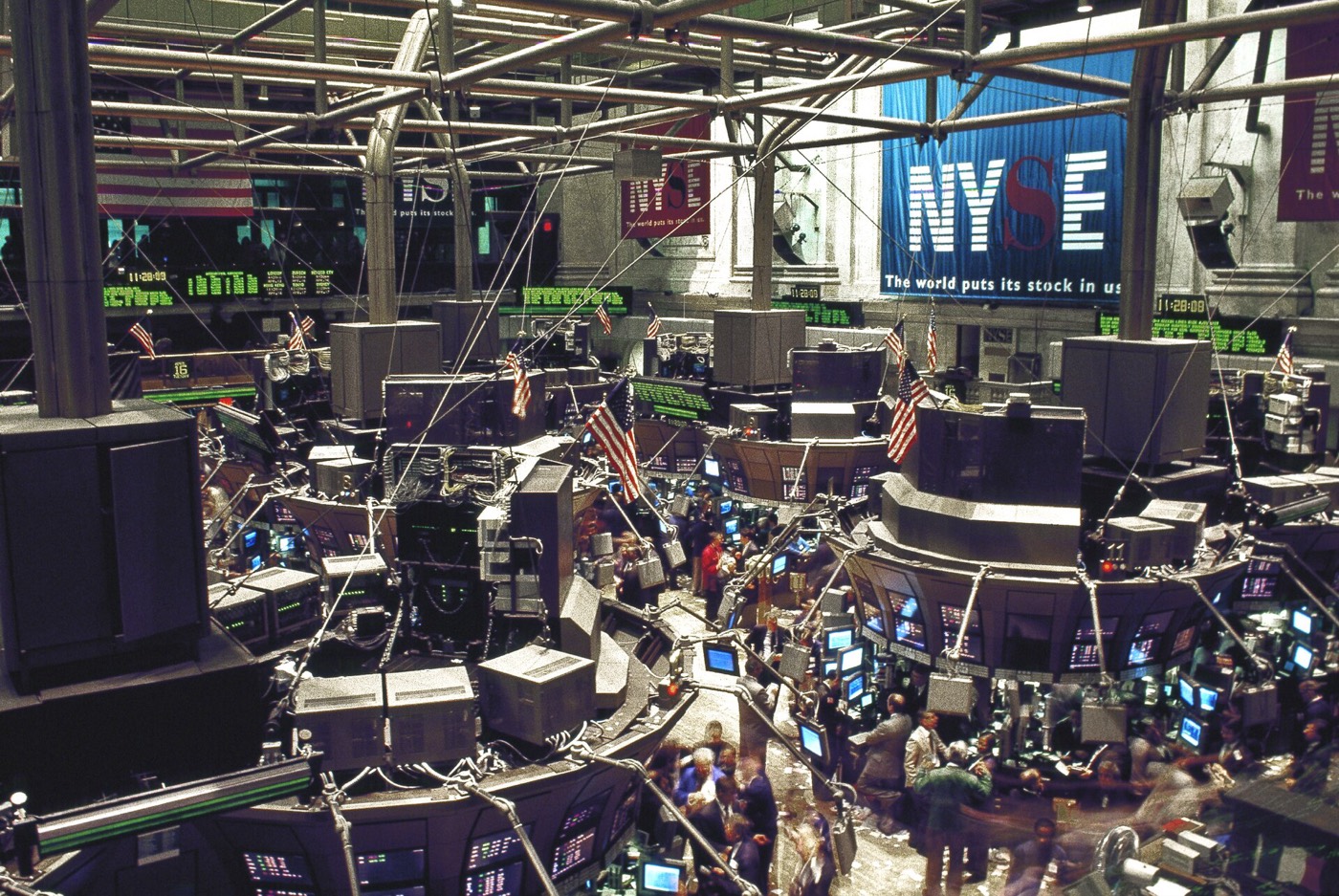 The trading floor of the New York Stock Exchange, crowded with booths and screens